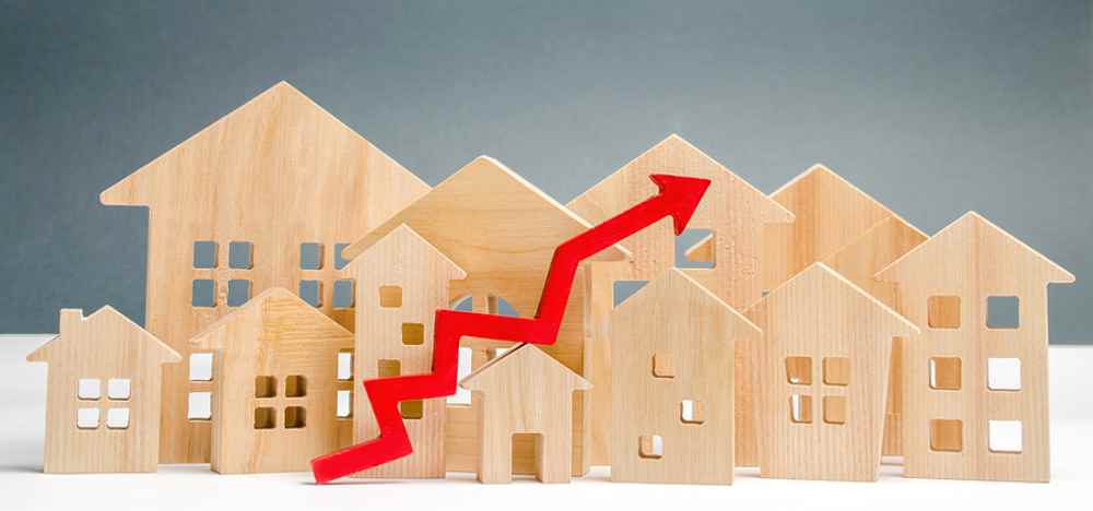 Wooden Homes with red arrow going up